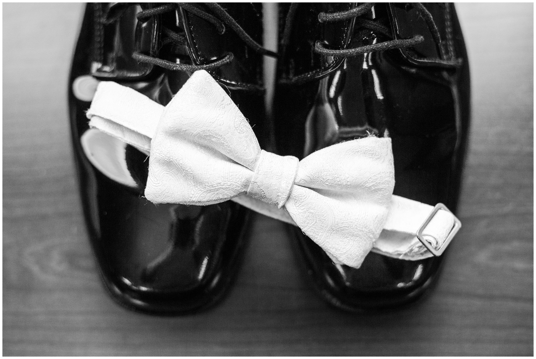 grooms details, white bow tie, grooms bow tie, bow tie and shoes, shiny wedding shoes, grooms wedding shoes, black and white wedding photo,